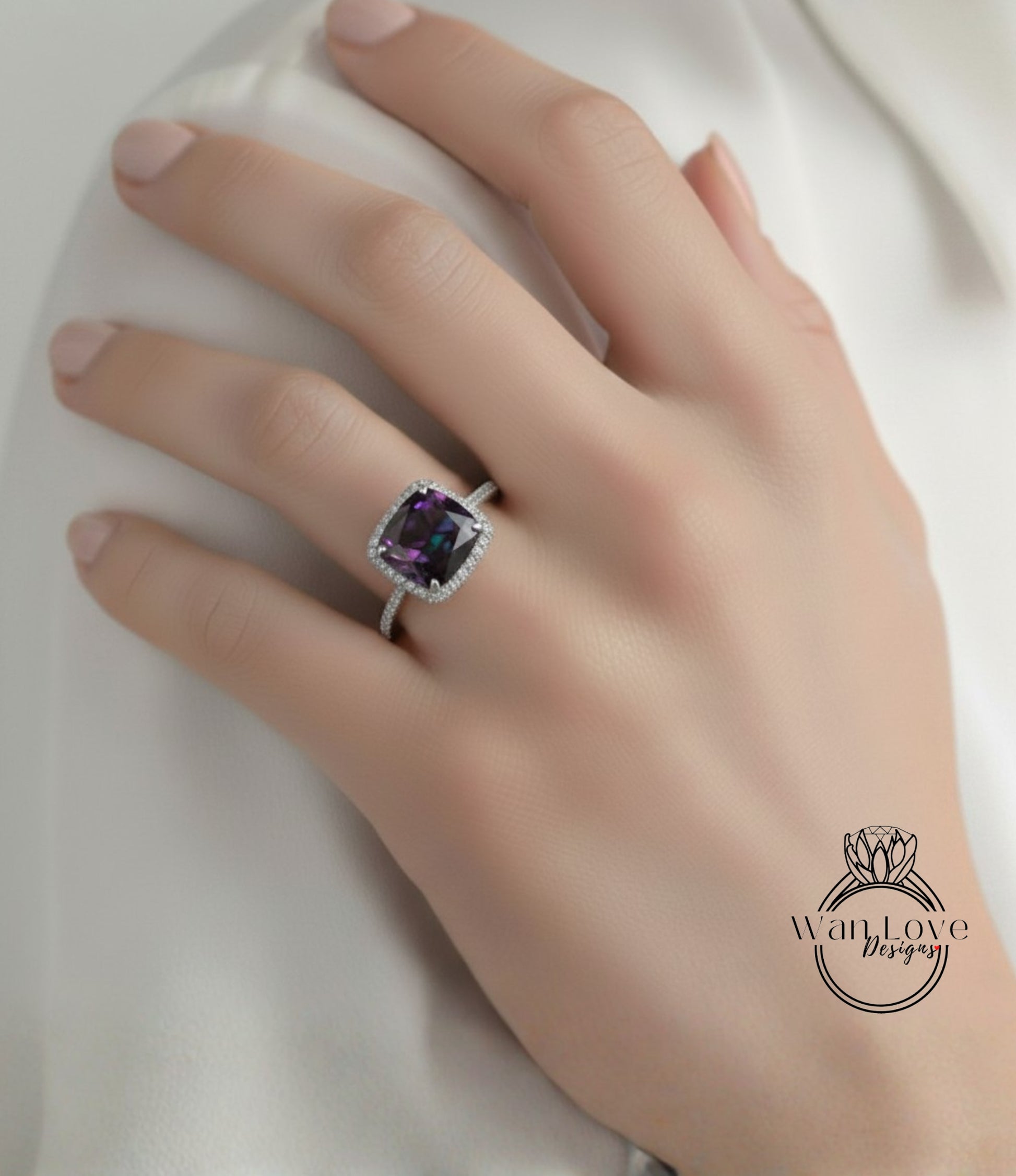 A close-up of a hand wearing a ring with a large purple gemstone.
