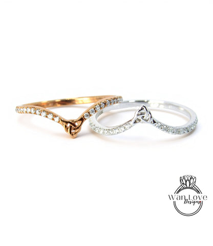Two rings with a knot design and small diamonds are displayed against a white background.
