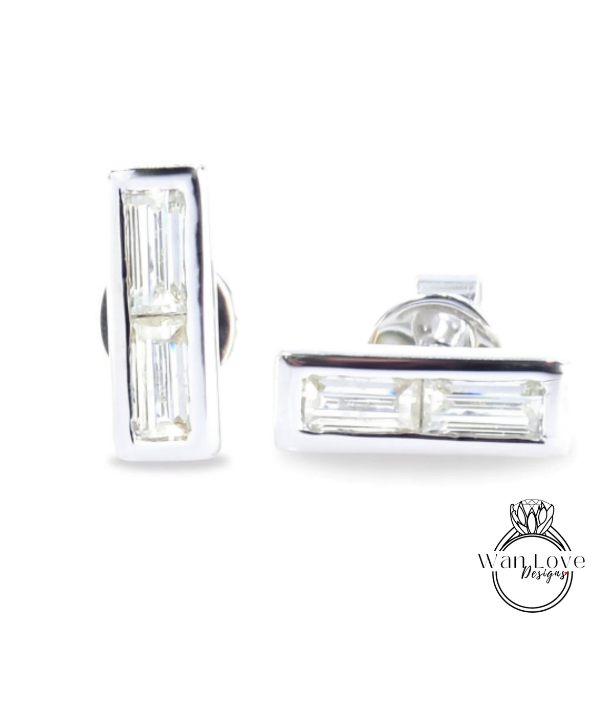 A pair of silver earrings with rectangular-shaped cut gemstones.