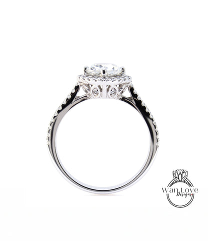 A close-up view of a silver ring with a large central diamond and smaller diamonds around the edge.