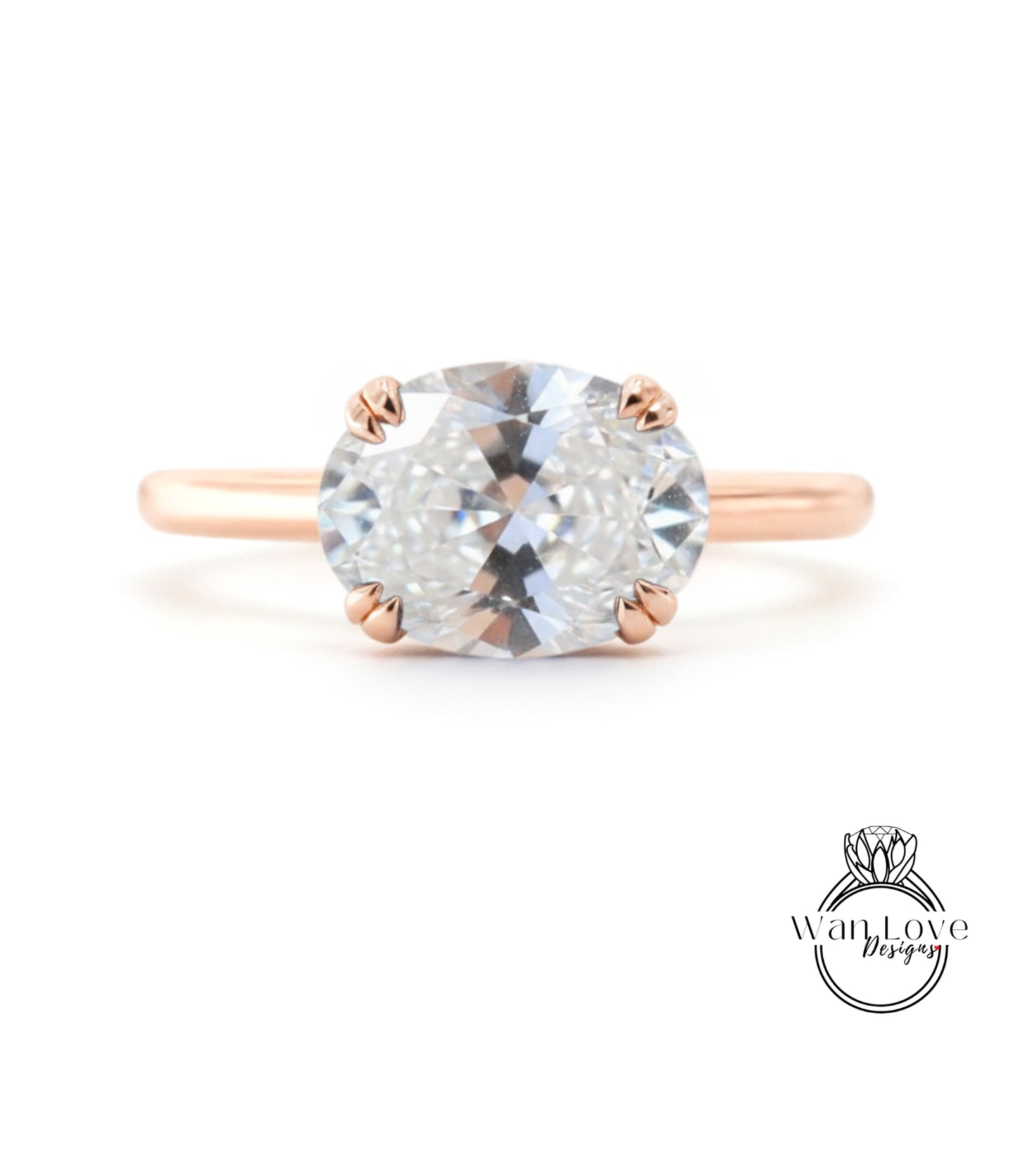 A rose gold engagement ring with a large, clear gemstone set in the center.