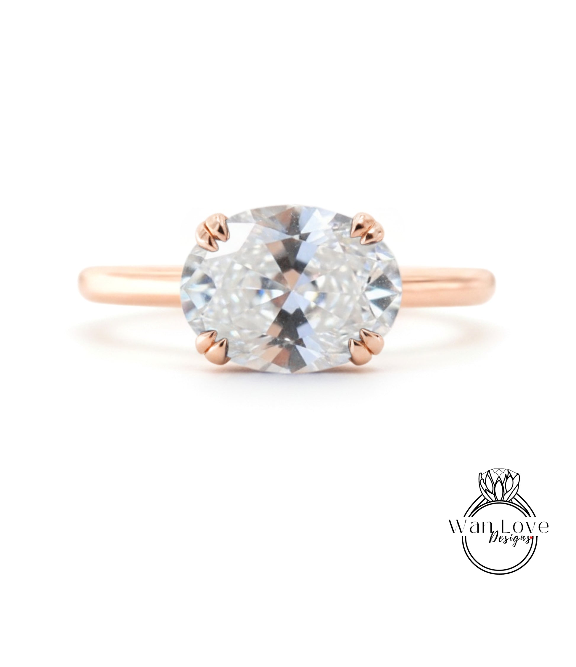 A rose gold engagement ring with a large, clear gemstone set in the center.