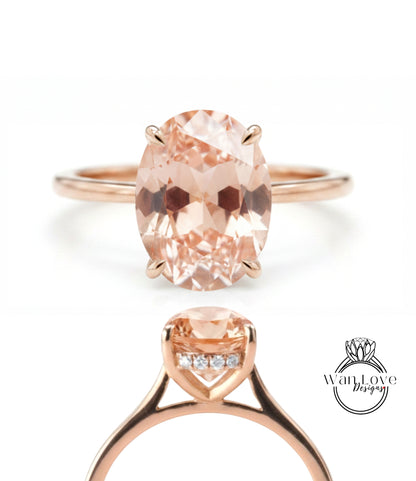 a rose gold ring with a large oval-shaped gemstone set in the center.
