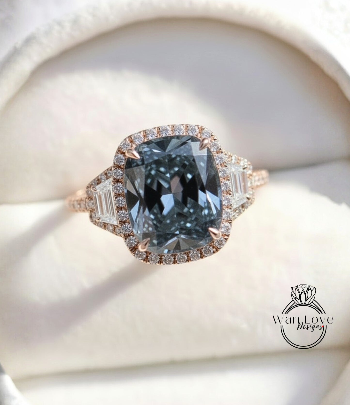 A close-up image of a diamond engagement ring with a large blue gemstone set in a halo of smaller diamonds.