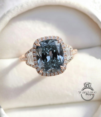 A close-up image of a diamond engagement ring with a large blue gemstone set in a halo of smaller diamonds.