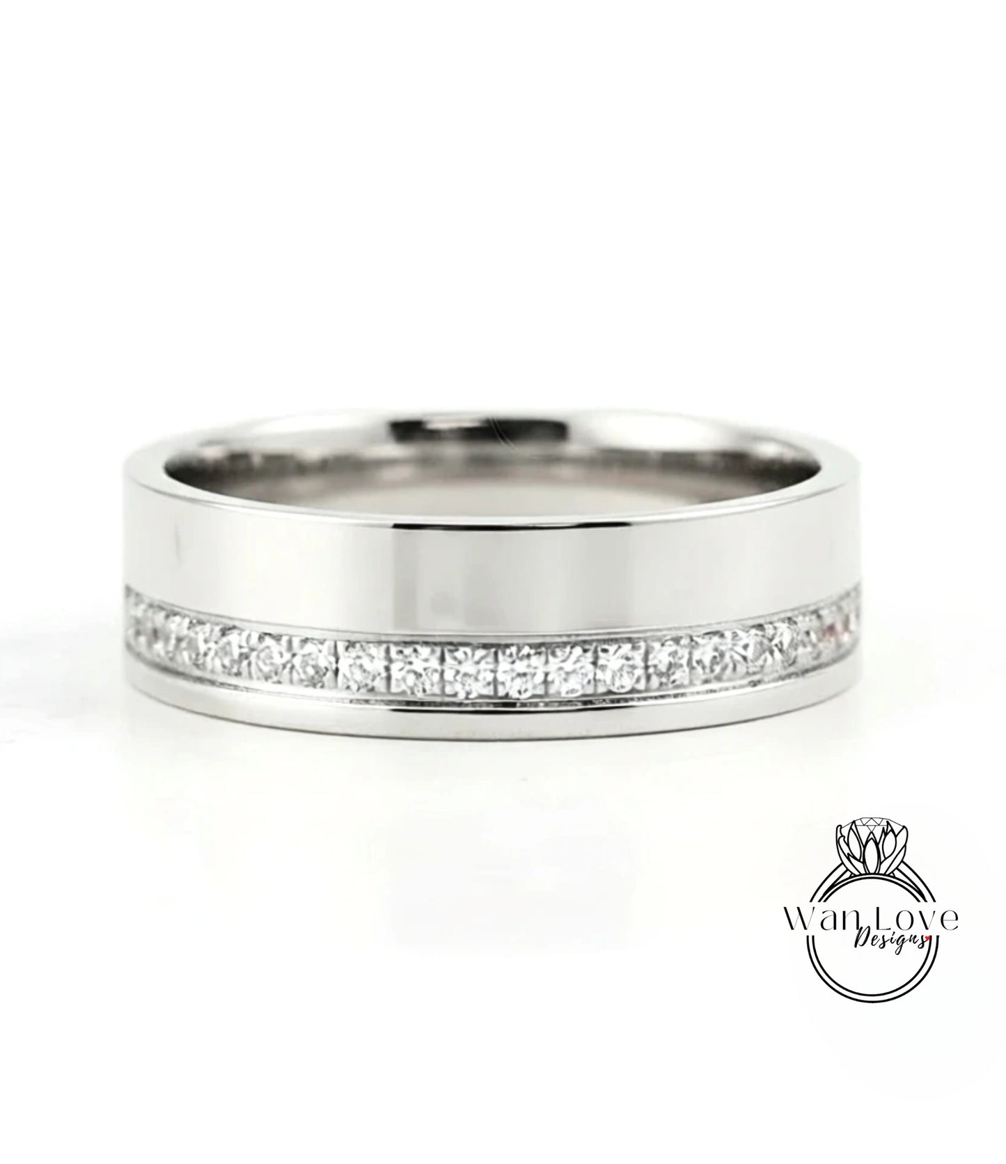A silver-colored wedding band with a row of diamonds set along the inside of the band.