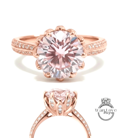 a beautiful pink diamond engagement ring with a large central diamond surrounded by smaller diamonds on the band.