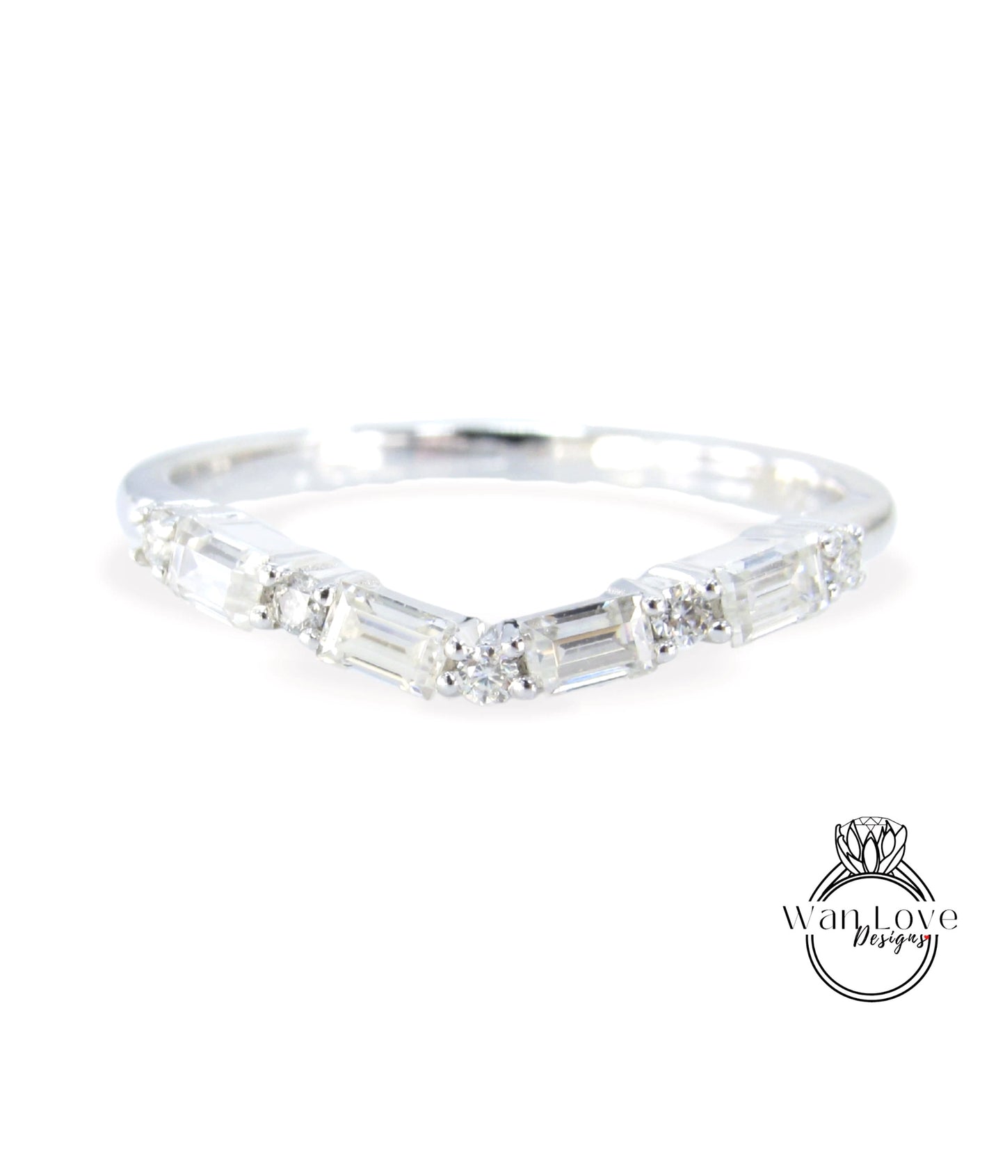 A silver ring with a unique design featuring a series of small diamonds arranged in a curved pattern.