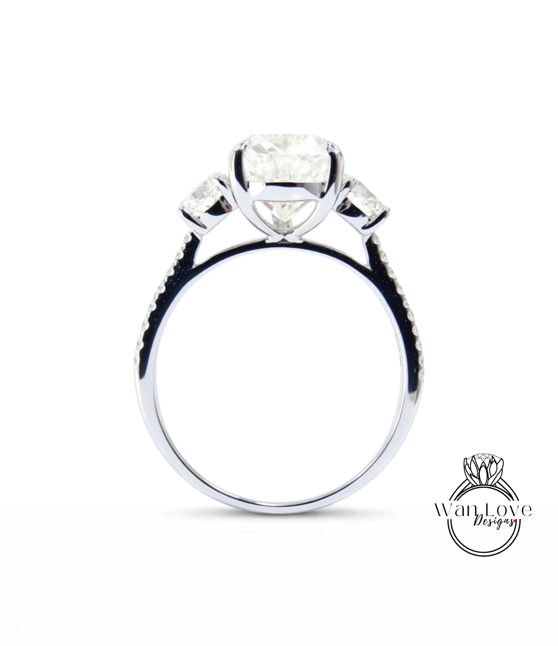 A silver engagement ring with a large central diamond and three smaller diamonds on either side.