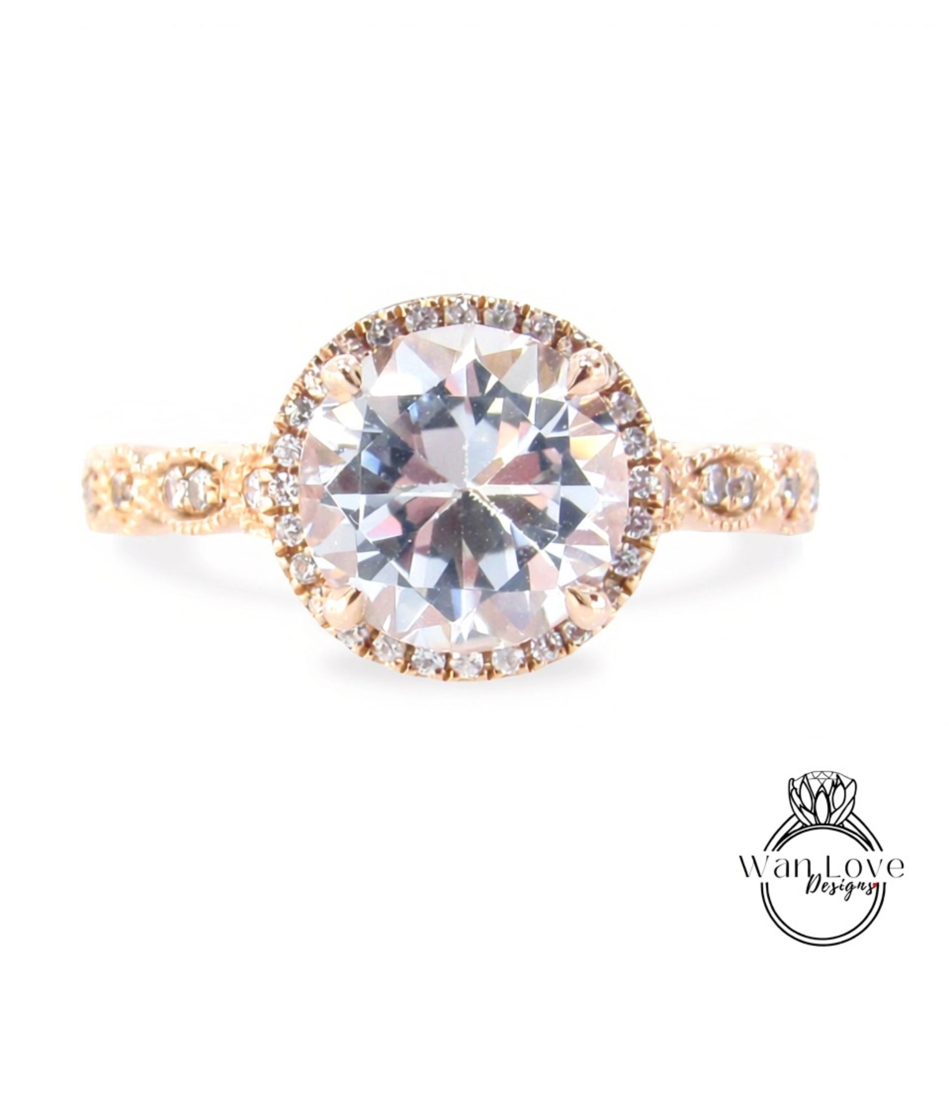 A beautiful engagement ring with a large round diamond set in a halo of smaller diamonds, surrounded by a delicate gold band.