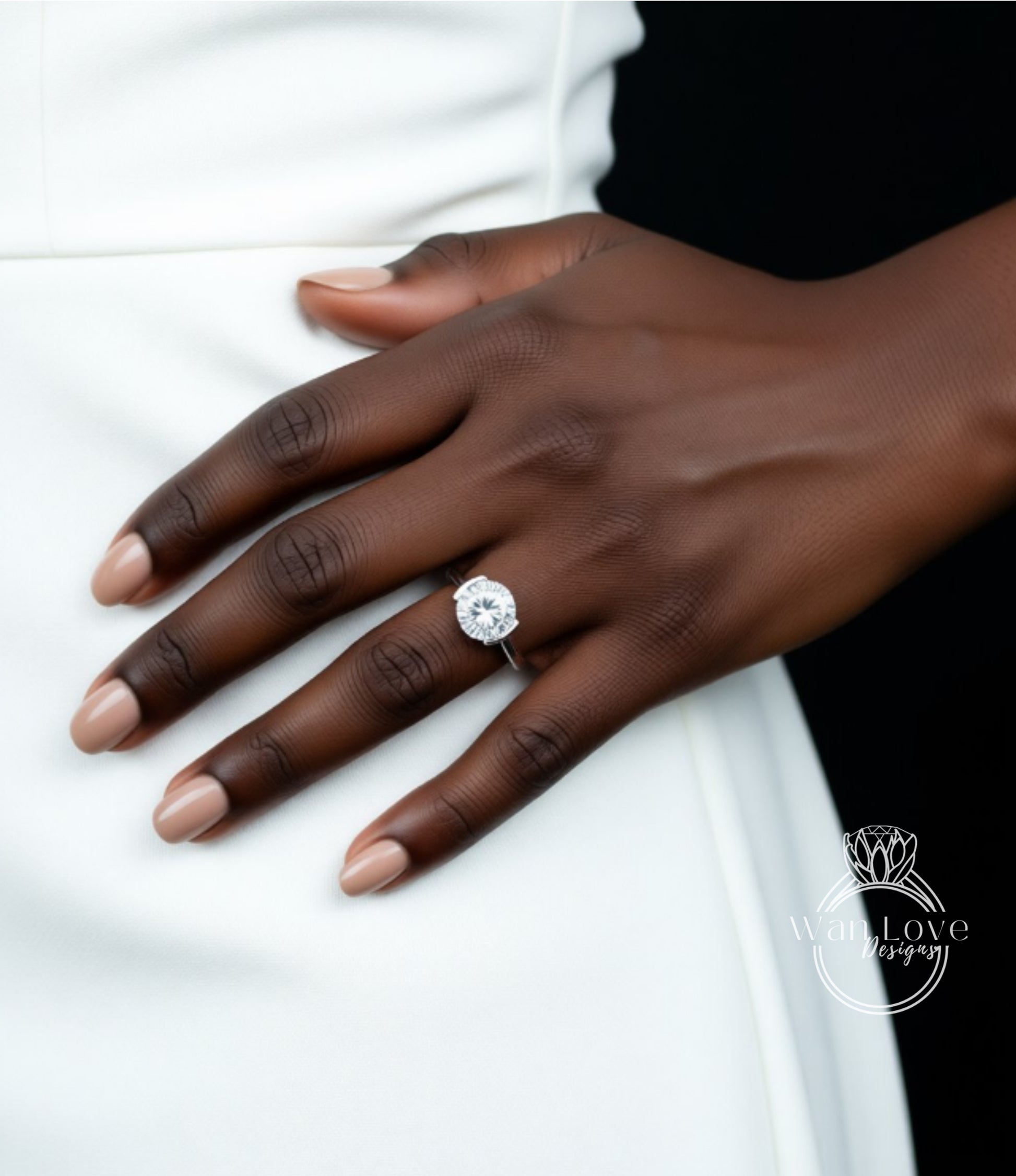 A close-up of a hand wearing a large diamond engagement ring.