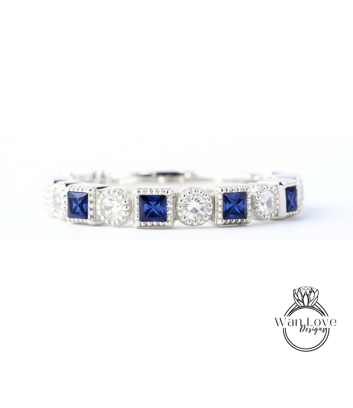 A silver and blue diamond-encrusted bracelet with square-shaped blue gemstones.