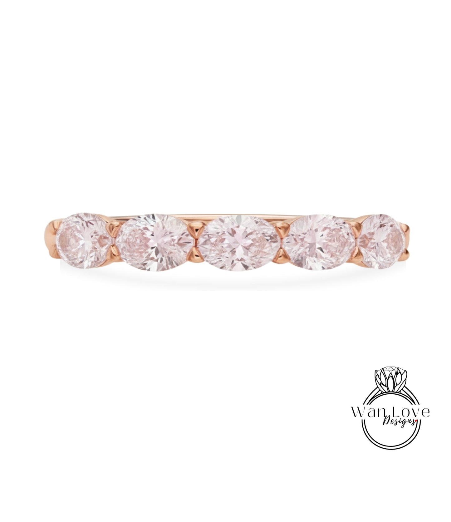 A rose gold ring with a row of five round diamonds set in the band.