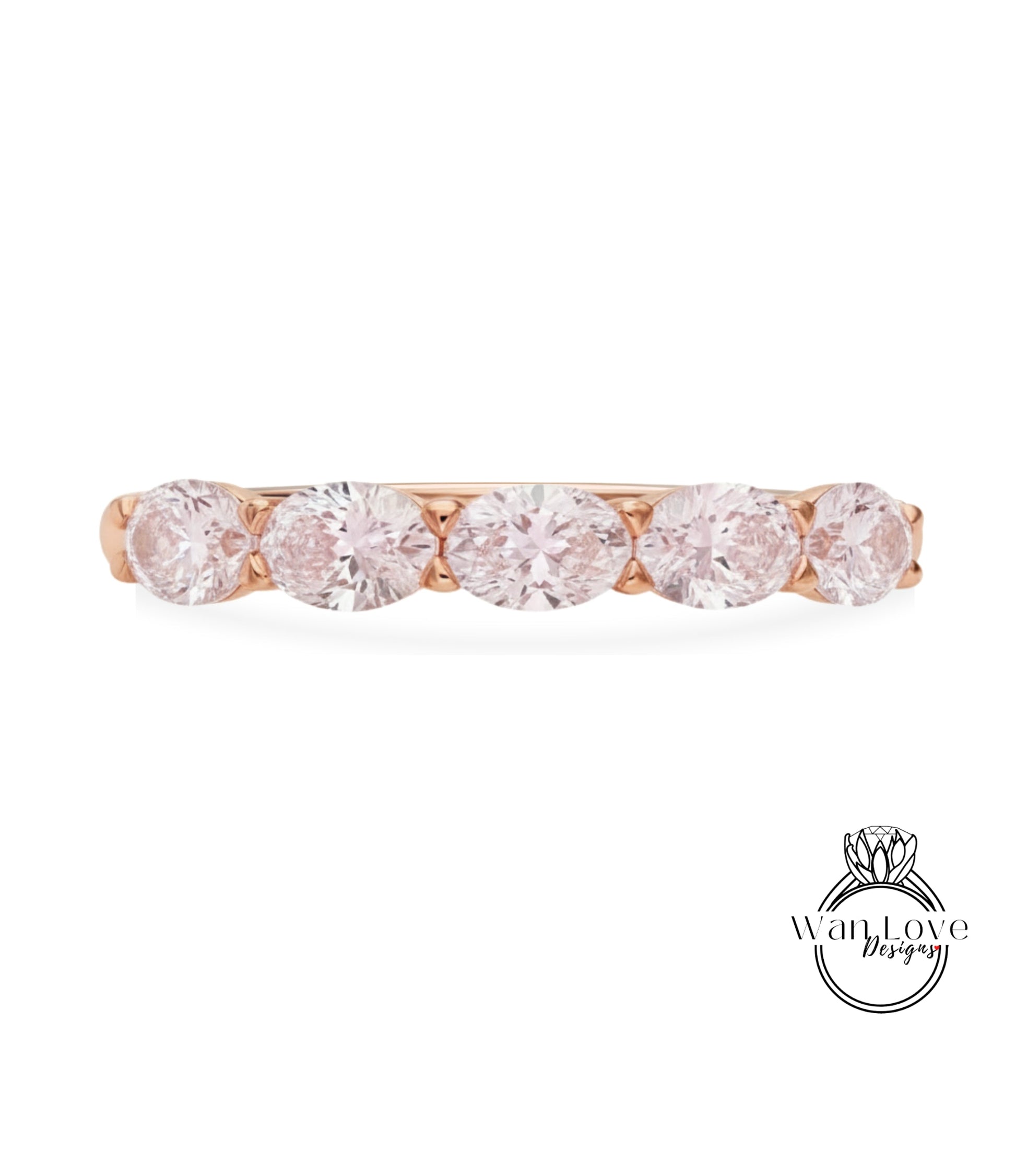 A rose gold ring with a row of five round diamonds set in the band.