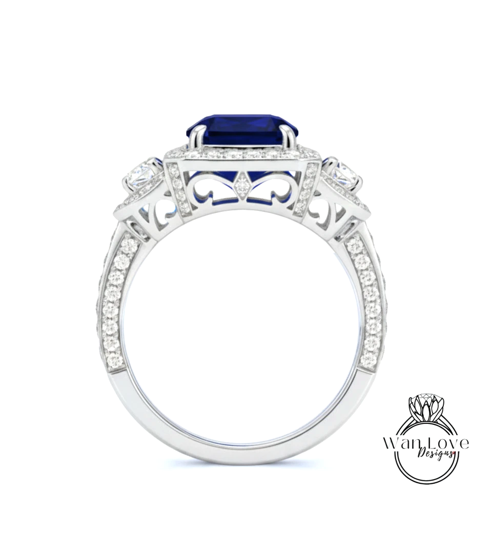 A silver ring with a large blue gemstone, surrounded by smaller diamonds and intricate designs.