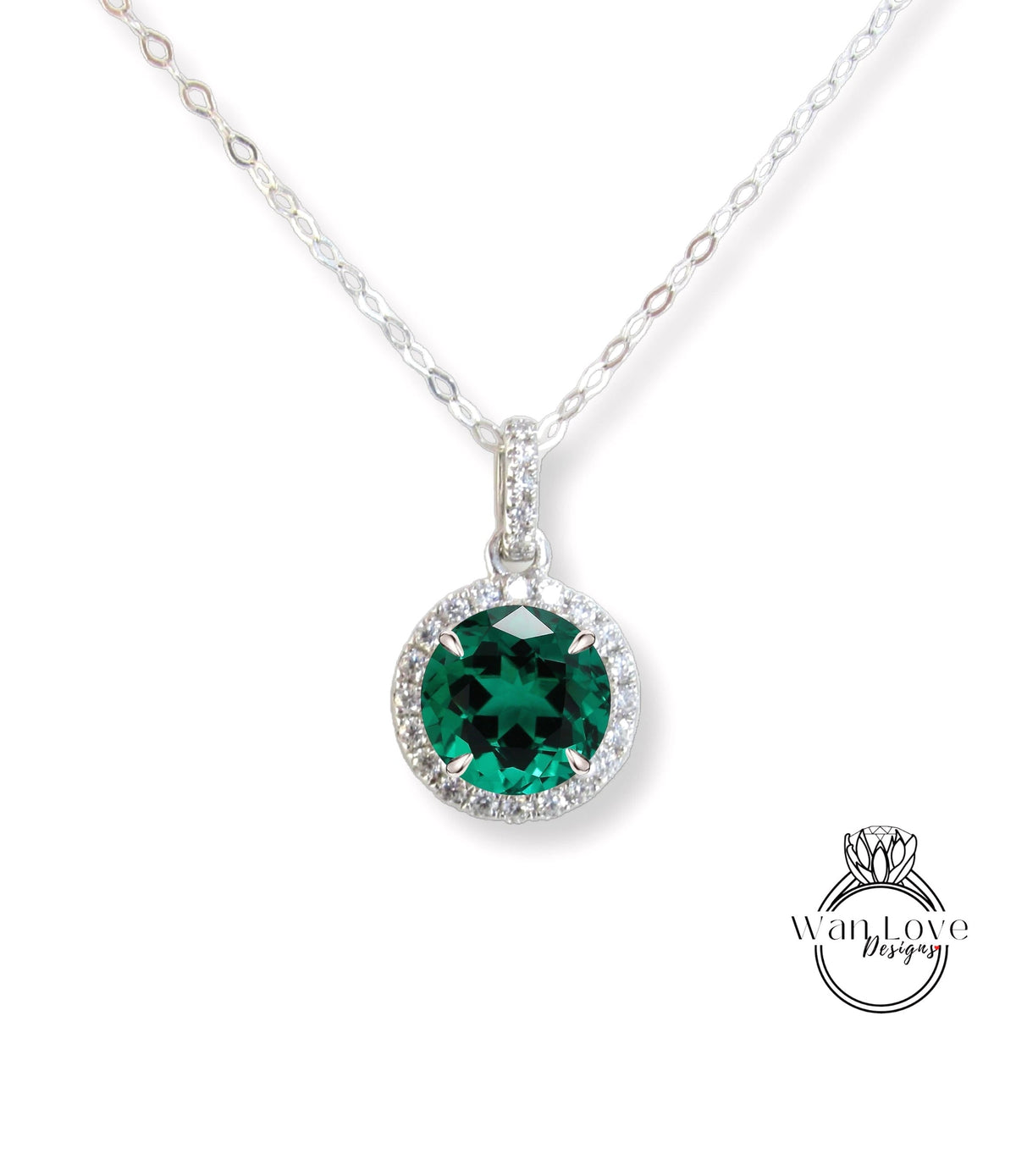 A necklace with a large, green gemstone pendant.