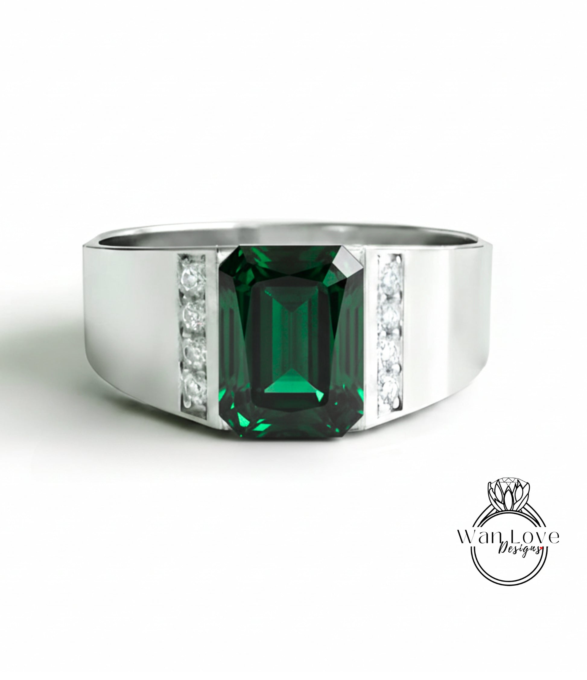 A silver ring with a large, green gemstone in the center.