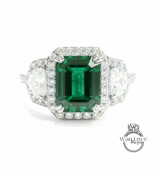 A stunning engagement ring with a large, vibrant green gemstone surrounded by a halo of sparkling diamonds.