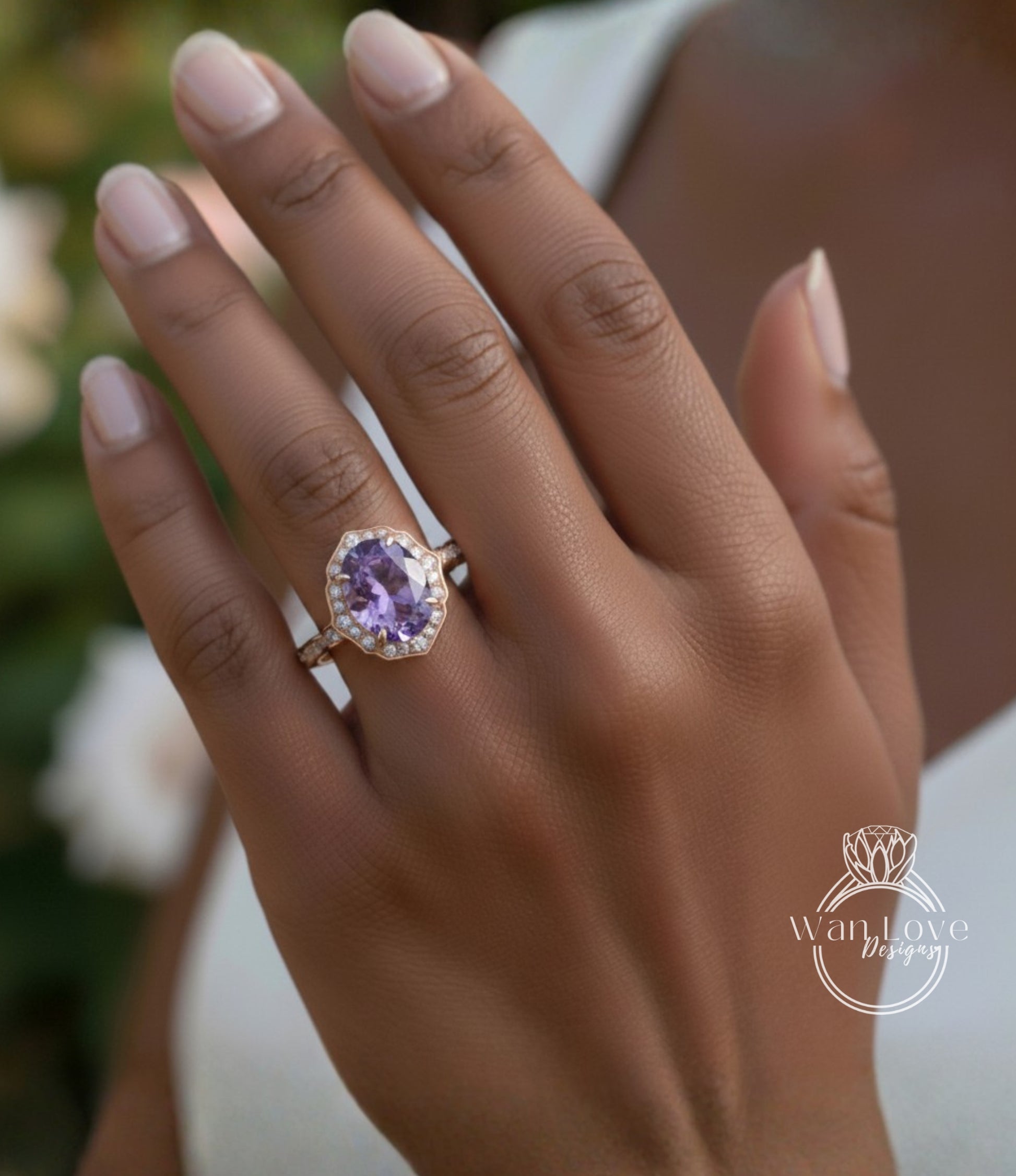 A close-up of a person's hand wearing a gold ring with a large purple gemstone.