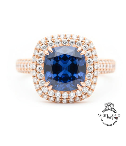 A stunning diamond ring with a large blue gemstone at the center, surrounded by a halo of smaller diamonds.