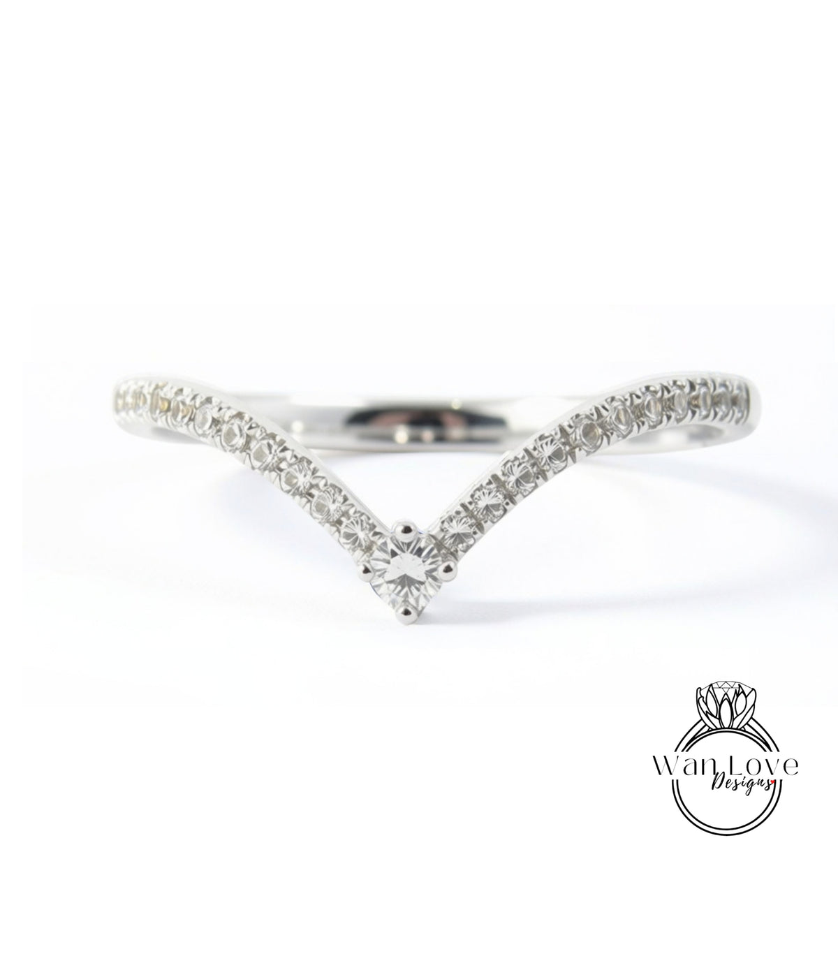 A silver ring with a large central diamond and a row of smaller diamonds along the band.