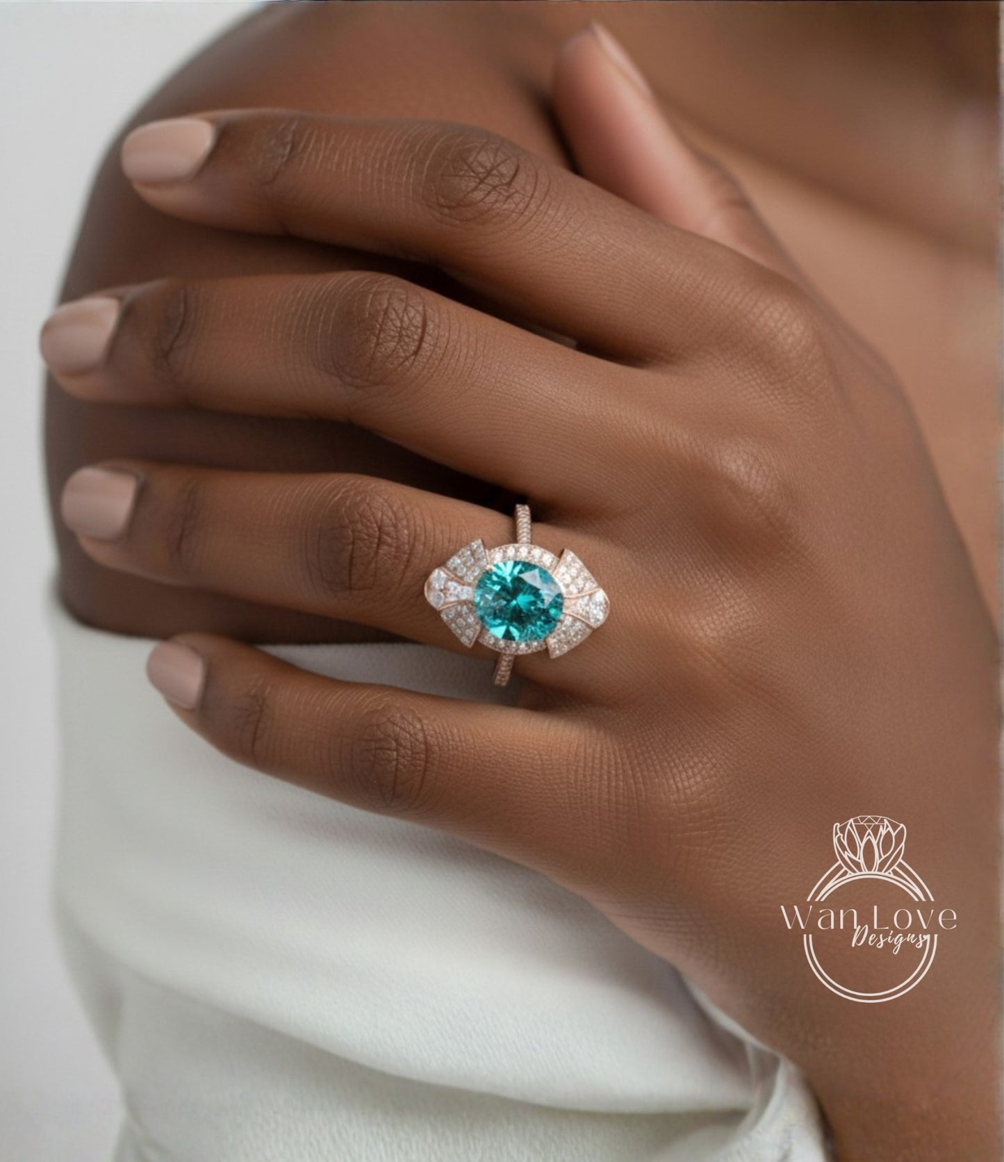 A close-up of a person's hand wearing a ring with a large, turquoise gemstone.