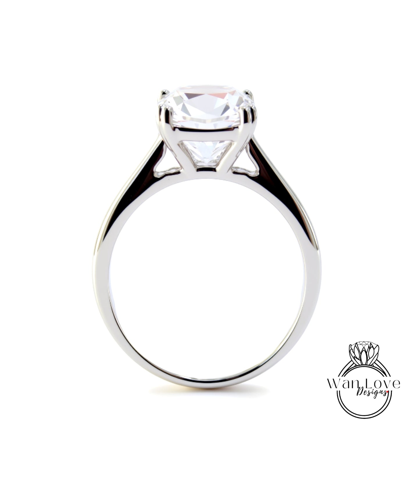 A silver engagement ring with a large, clear gemstone set in the center of the band.