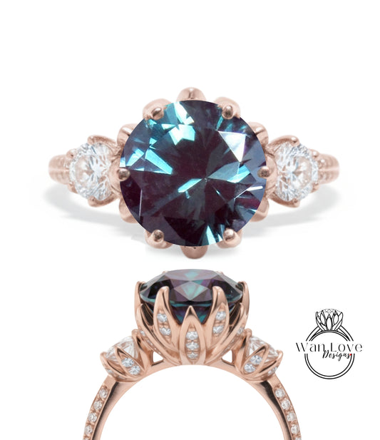 a beautiful engagement ring with a large blue gemstone set in a rose gold band. The ring is adorned with smaller diamonds and has a delicate floral design around the gemstone.