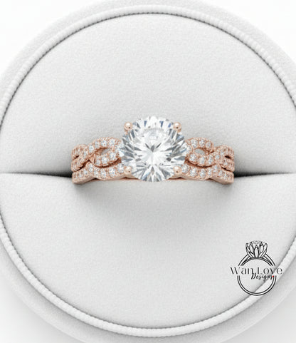 A beautiful engagement ring with a large round diamond set in a rose gold band, displayed in a white jewelry box.