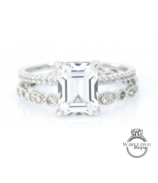 A close-up view of a diamond engagement ring with a large, clear gemstone set in a silver band.