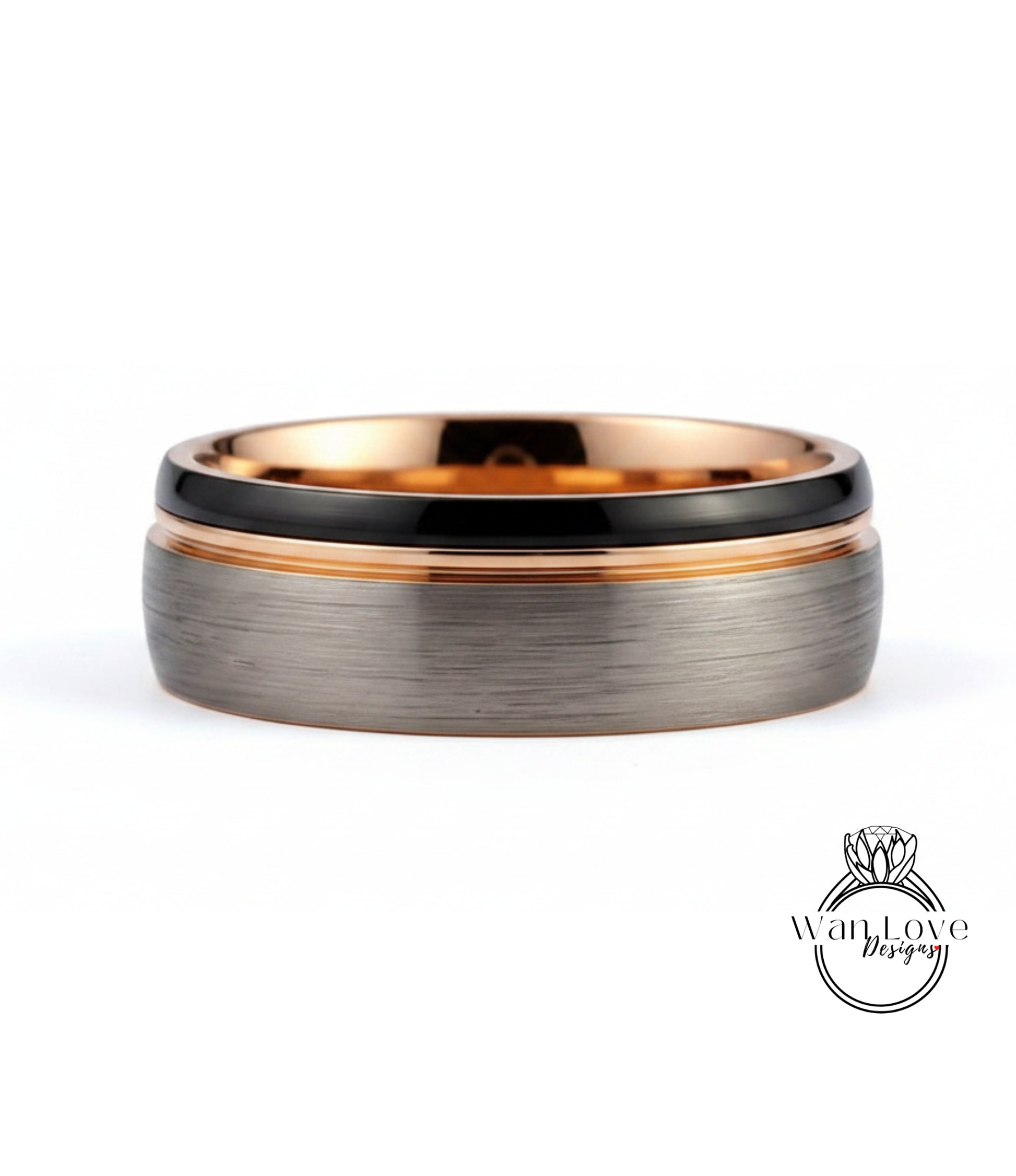 A silver ring with a black band and a thin gold band, set against a white background.