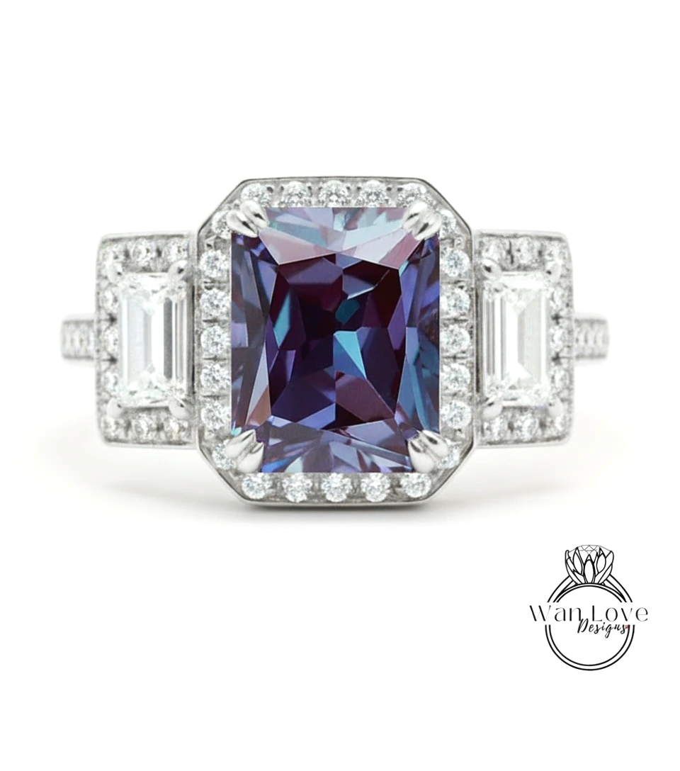 A stunning diamond engagement ring with a large, deep purple gemstone surrounded by smaller diamonds and set in a silver band.