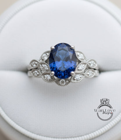 A close-up image of a silver ring with a large blue gemstone, showcasing the intricate design and craftsmanship of the piece.