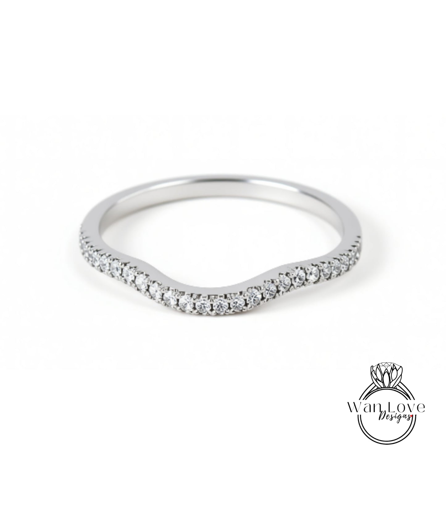 A silver ring with a curved band and small diamonds set in it.