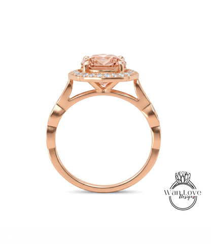 A rose gold ring with a large pink gemstone set in the center, surrounded by smaller diamonds.