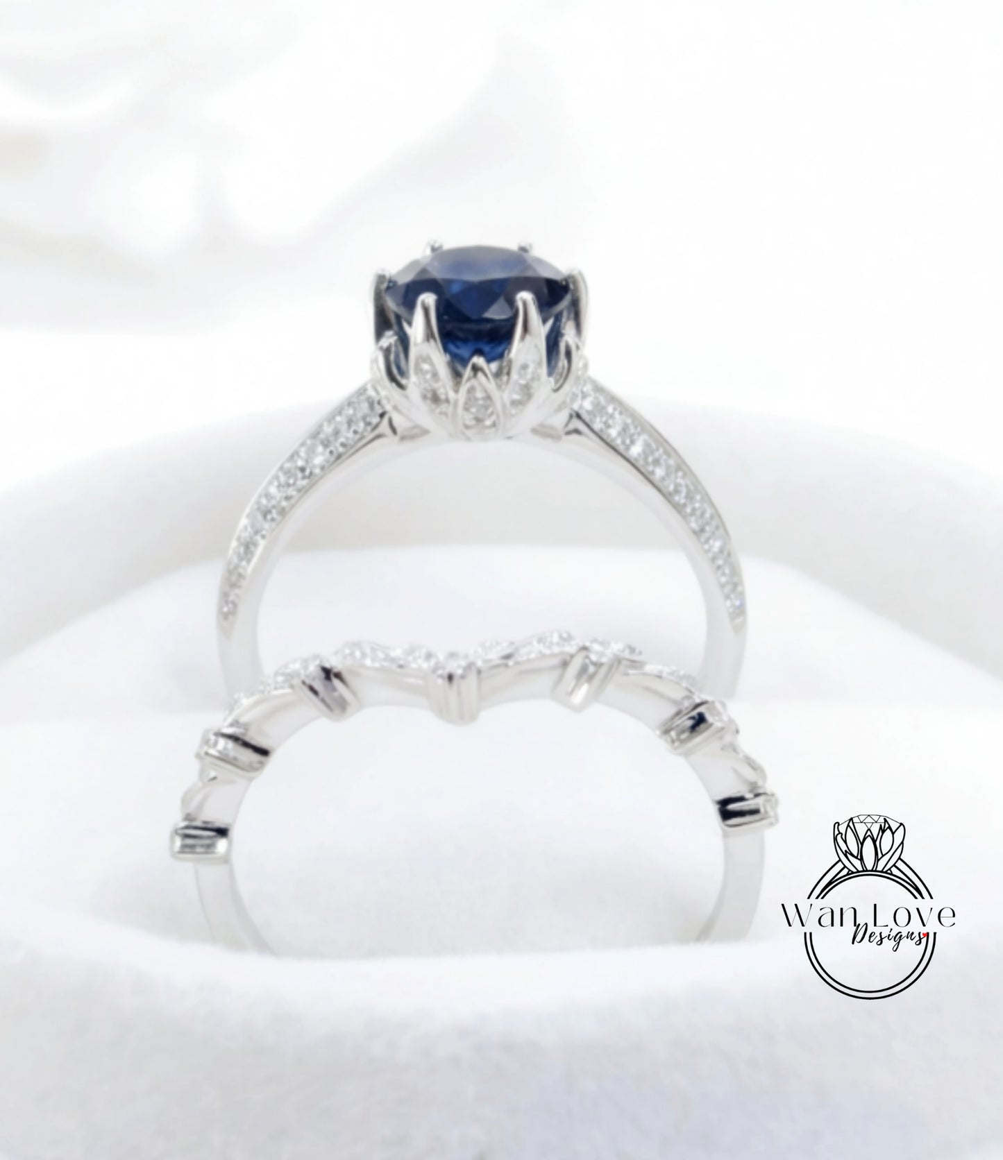 A close-up view of a silver ring with a large blue gemstone, showcasing the intricate design and craftsmanship of the jewelry piece.