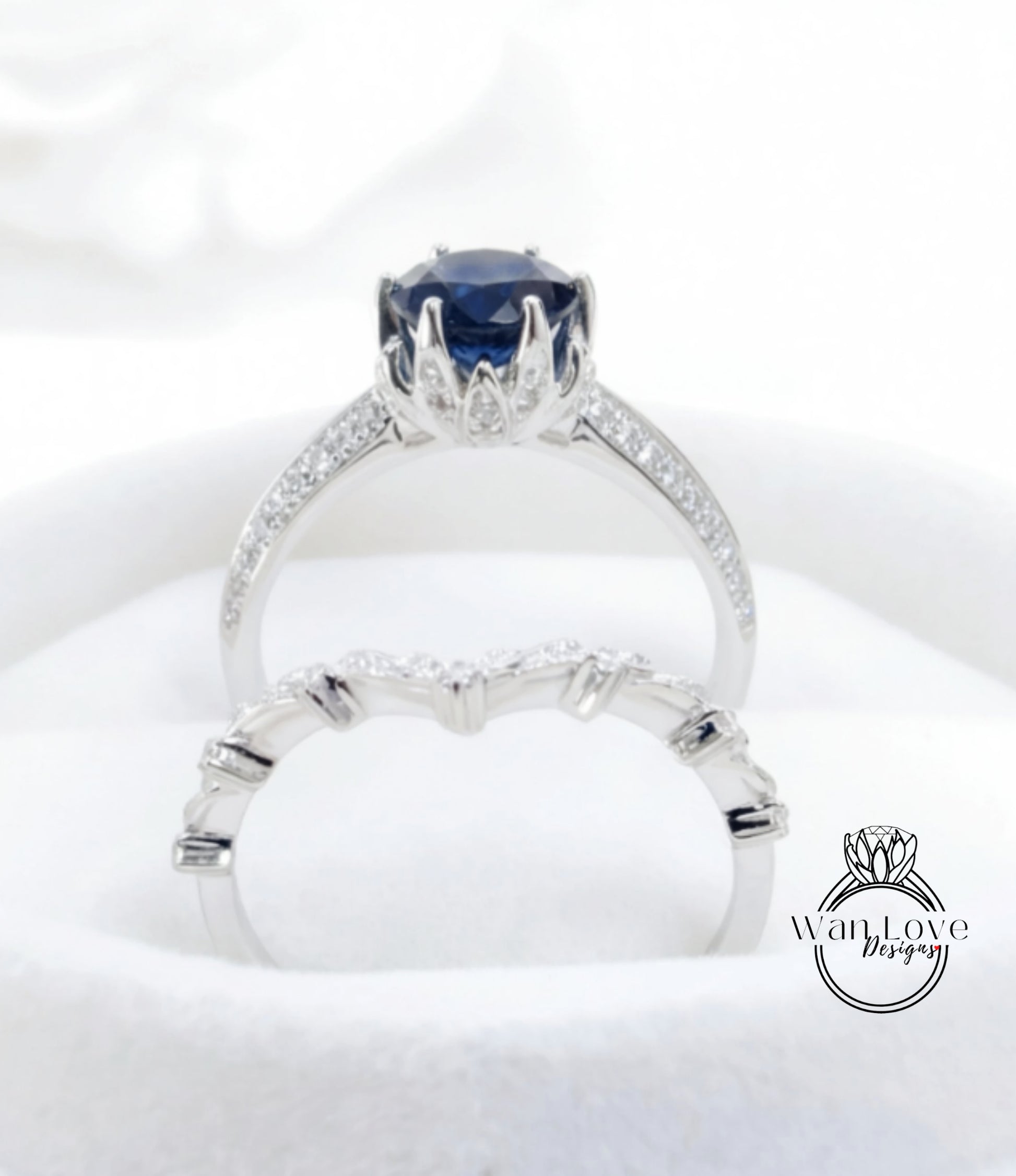 A close-up view of a silver ring with a large blue gemstone, showcasing the intricate design and craftsmanship of the jewelry piece.