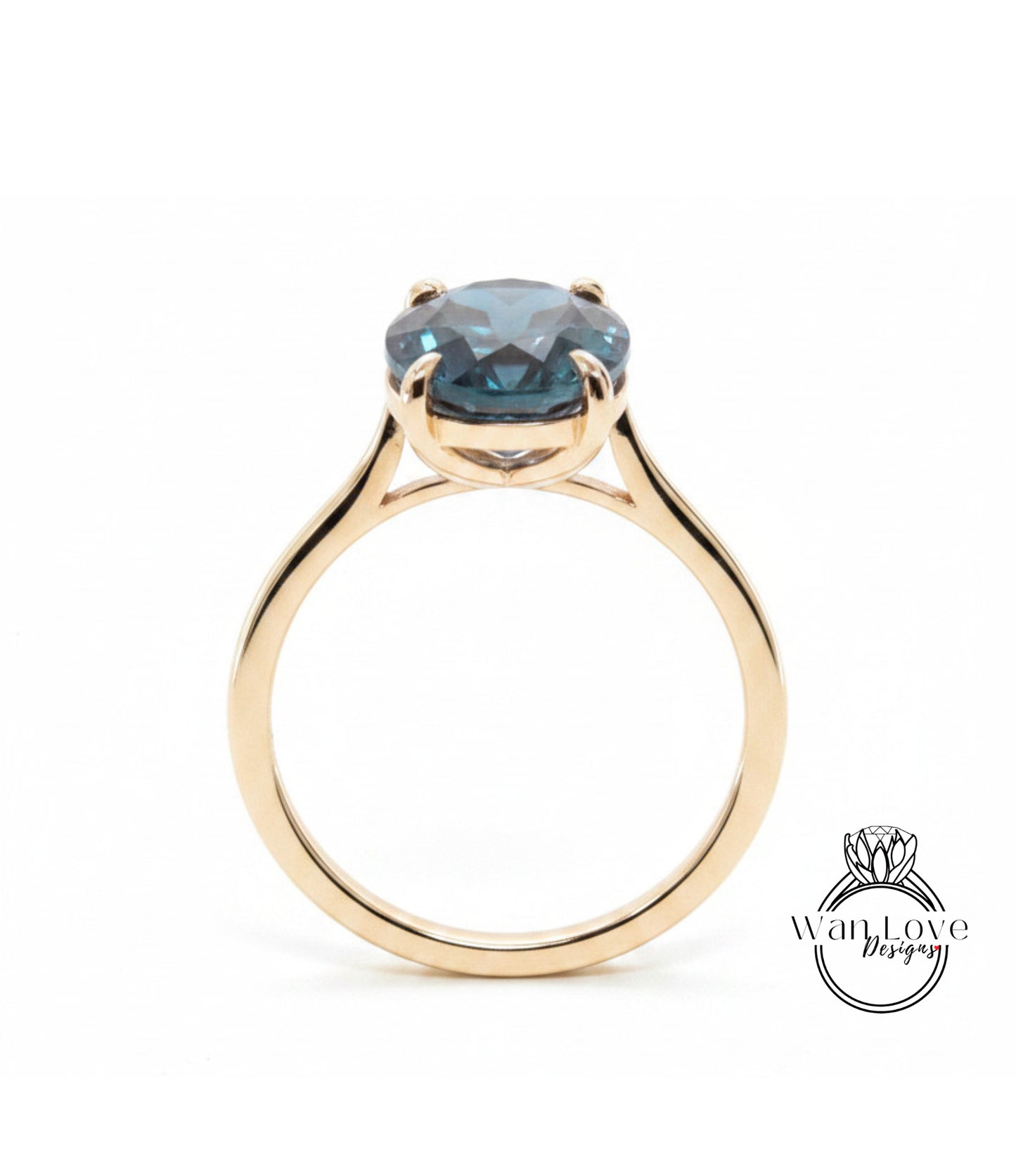A gold ring with a large blue gemstone set in the center.