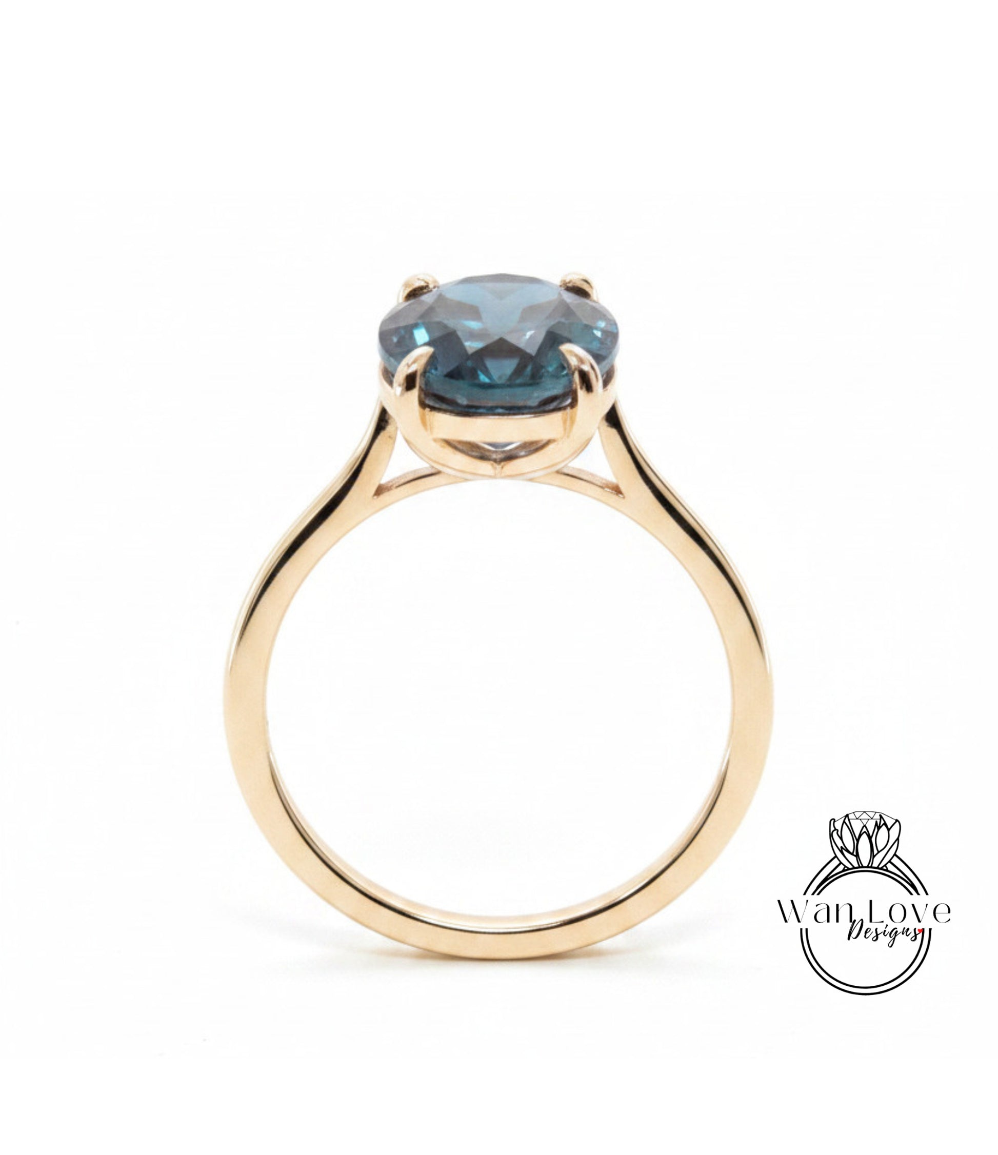 A gold ring with a large blue gemstone set in the center.
