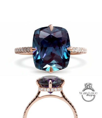 a large, blue gemstone ring with a rose gold band and a diamond accent.