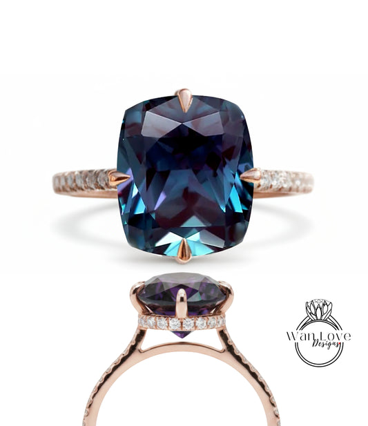 a large, blue gemstone ring with a rose gold band and a diamond accent.