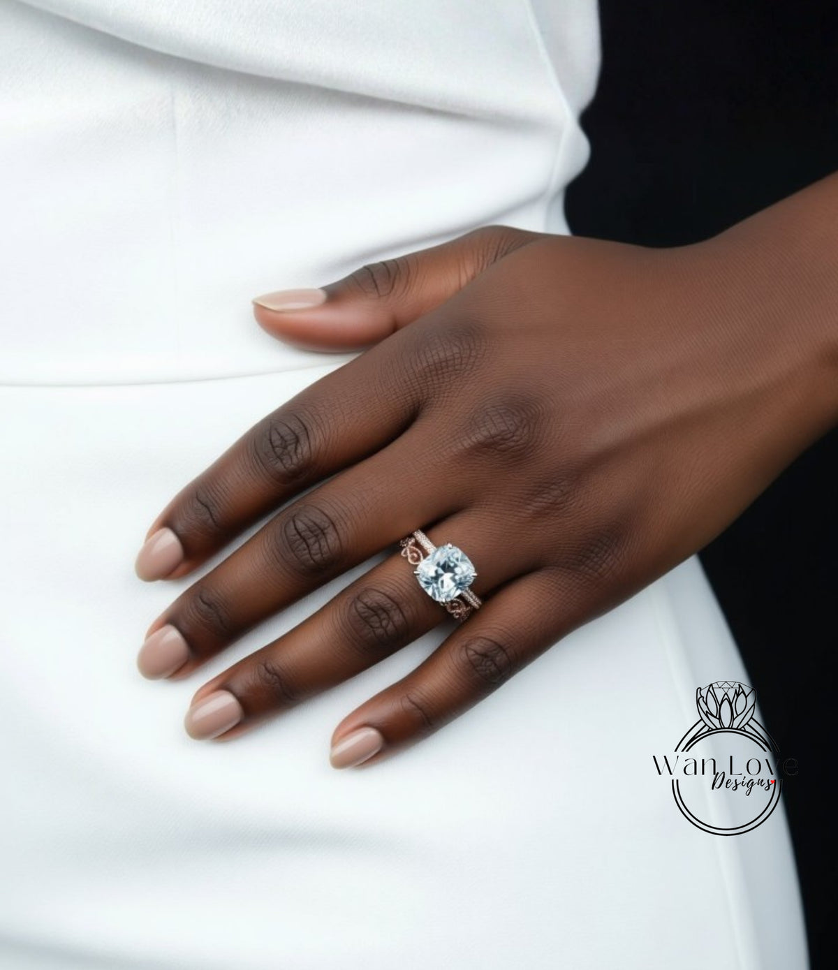 A close-up of a person's hand wearing a large diamond ring on the ring finger.