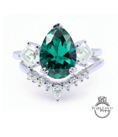 A silver ring with a large, green gemstone at the center, surrounded by smaller diamonds.