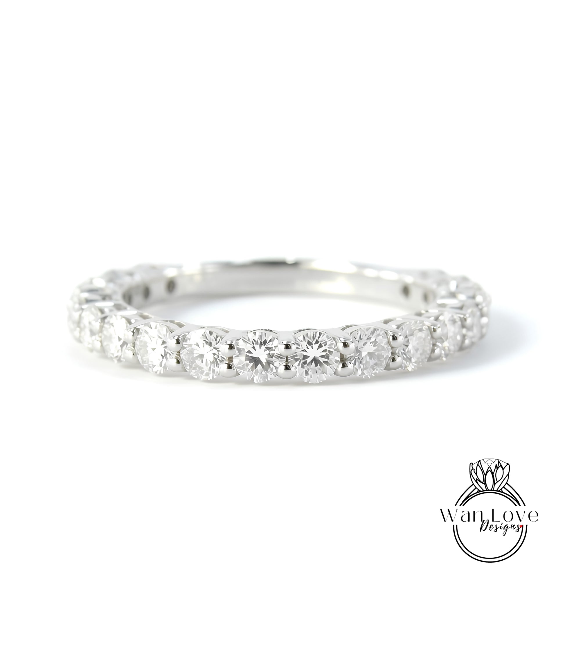 A diamond-encrusted ring with a row of round diamonds set in a silver band.