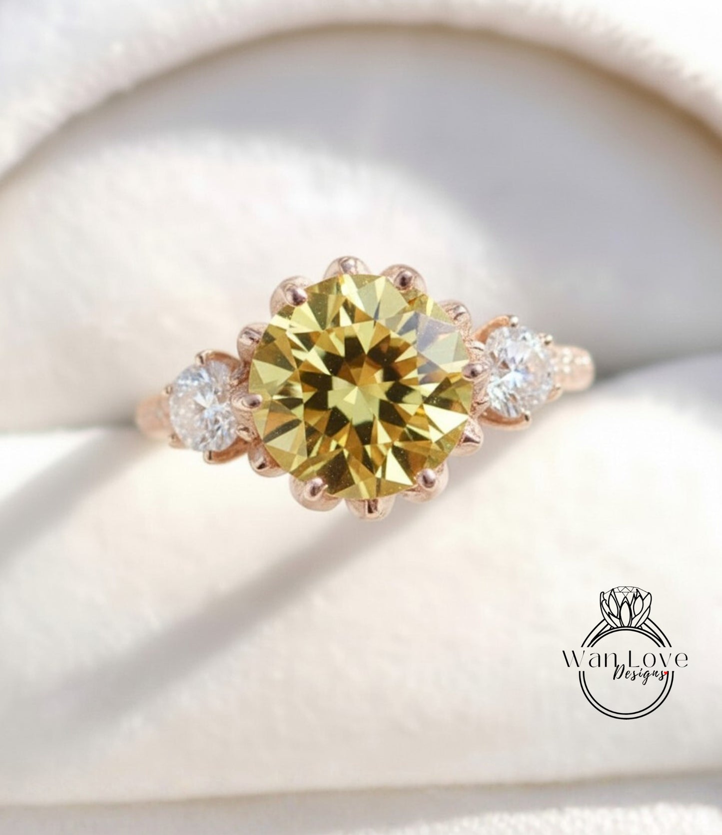 A close-up image of a gold ring with a large yellow diamond as the centerpiece, surrounded by smaller diamonds.