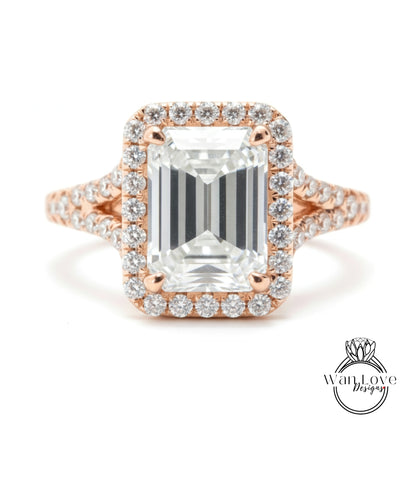 A large, clear diamond engagement ring with a halo of smaller diamonds around the center stone.