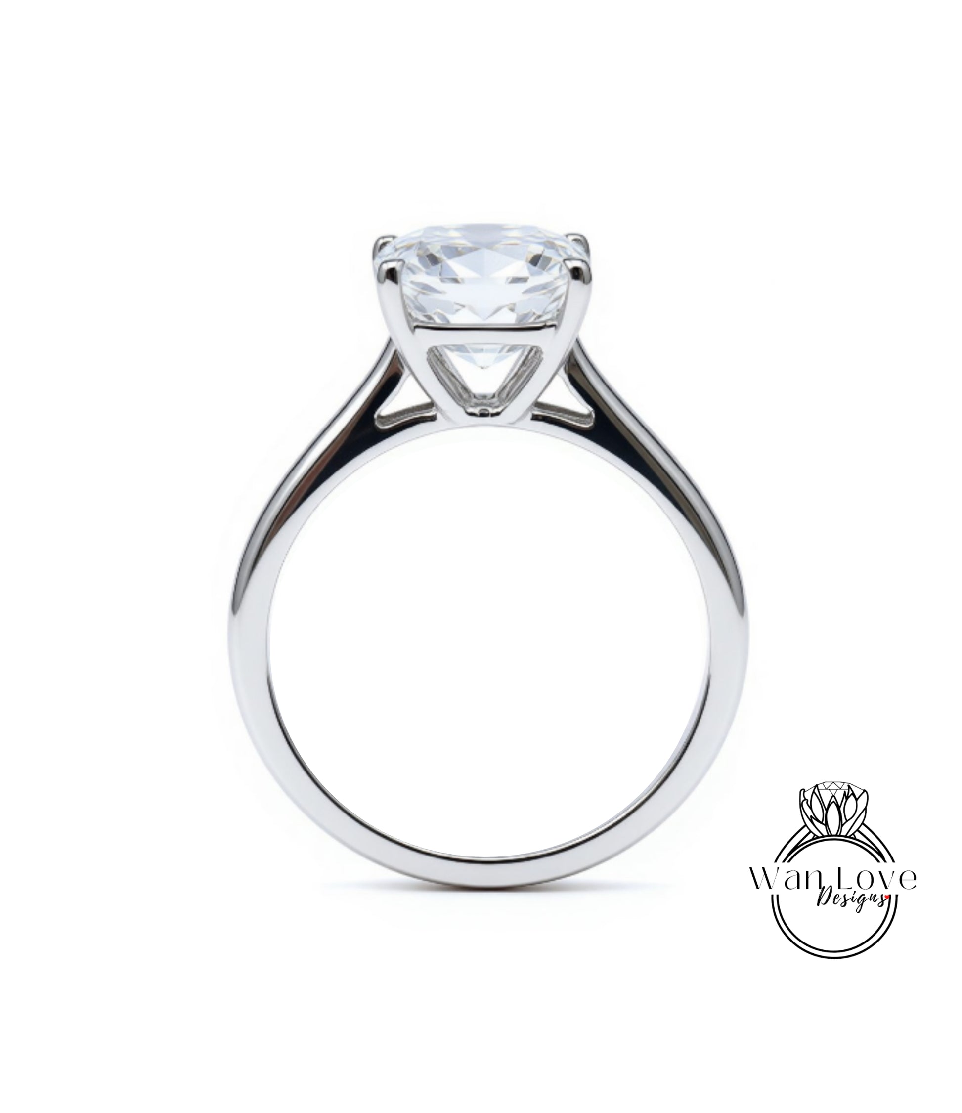 A silver engagement ring with a large, clear gemstone set in the center of the band.