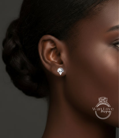 A close-up of a woman's ear with a diamond earring, showcasing the earring and the woman's face.