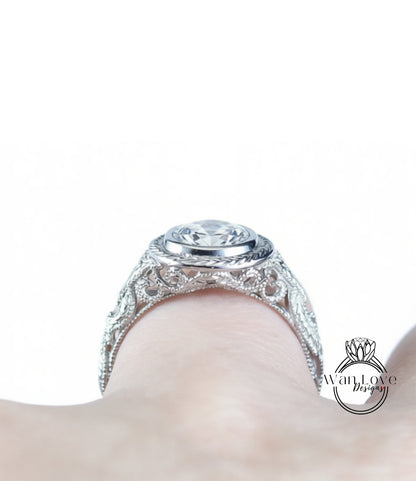 A close-up view of a diamond engagement ring on a person's hand, showcasing the intricate design and sparkling gemstone.