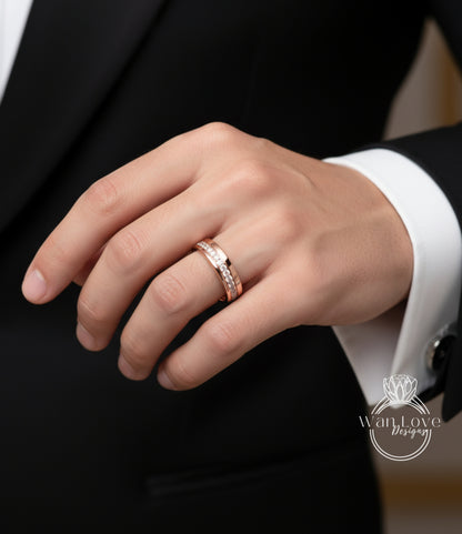 A close-up of a person's hand wearing a gold ring on the ring finger.